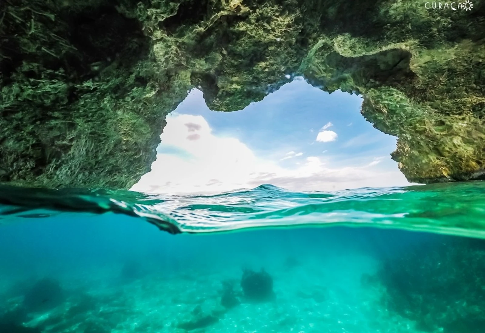 Turquoise water beneath a sea cave off Curaçao's west coast